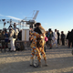 North and Brumder mourn Fredinburg in matching onesies at Burning Man in September 2015, only a year after their friend married them on the playa.